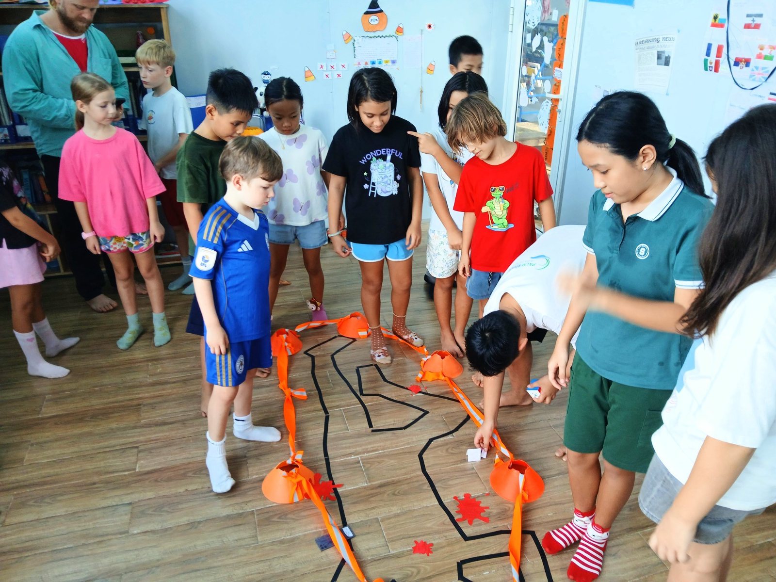Younger students looking for clues at the Year 7 Halloween mystery room
